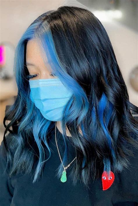 blue highlights on black hair|black hair with blue streak.